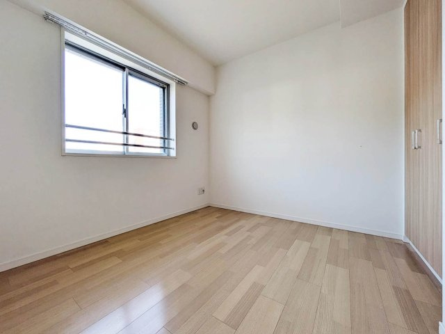 メイツブラン九条駅前の洋室