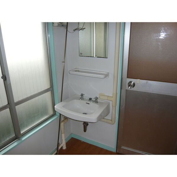 ニューマンション丸由の洗面所