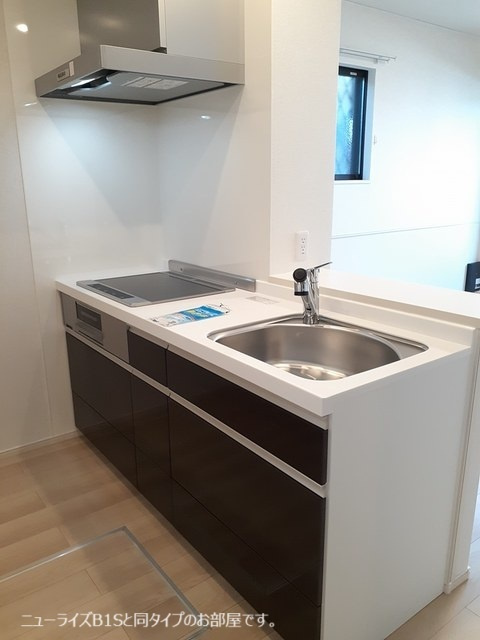 稲城市百村のアパートのキッチン