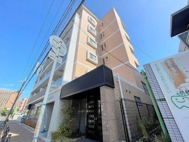 エクセレント21上新住販ビルの外観