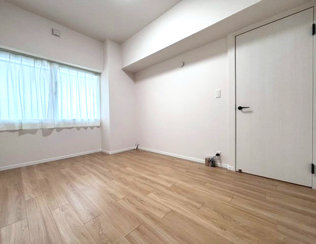 コープ野村月寒西の洋室