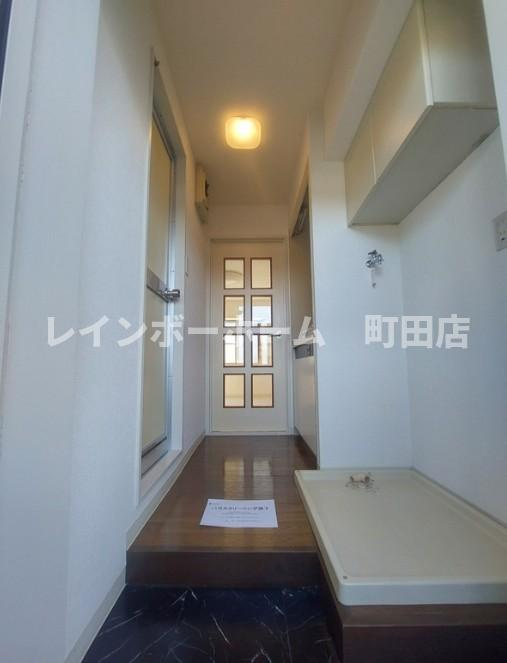 座間市栗原の賃貸マンションの玄関