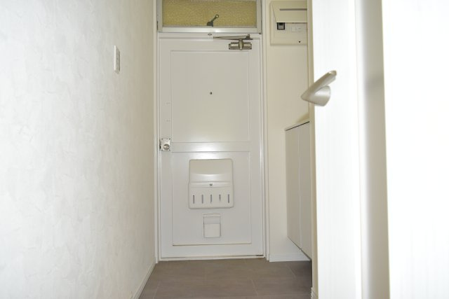 府中市晴見町１丁目の中古マンションの玄関