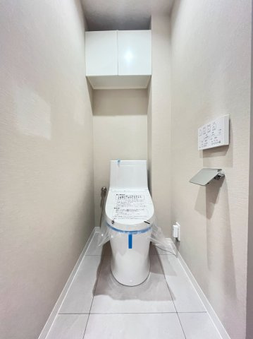 コスモ町屋のトイレ|落ち着いた色調のトイレです