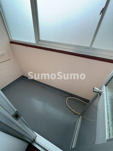 舞子片山住宅　５号棟のバルコニー|暖かな日差しのふりそそぐバルコニー