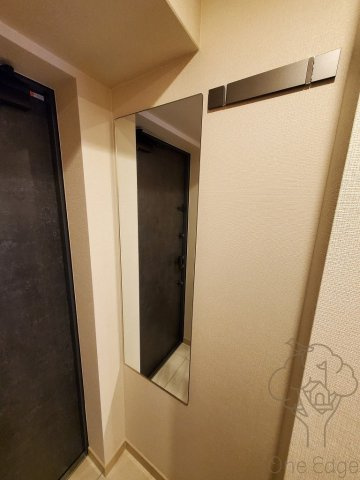 ファーストフィオーレ塚本リベルテの玄関