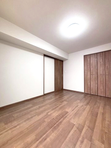 コープ野村幌西の洋室