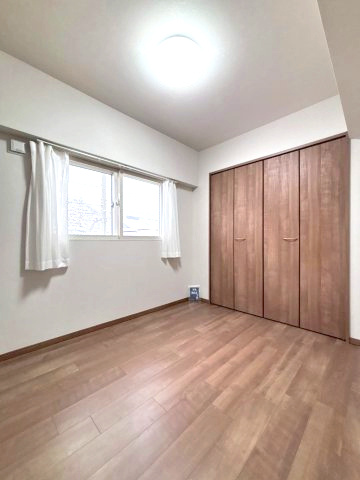 コープ野村幌西の洋室