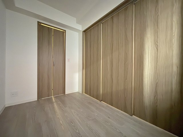 プランドール新北野の洋室