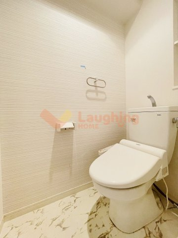 ポルタフォルトゥーナのトイレ|落ち着いた色調のトイレです