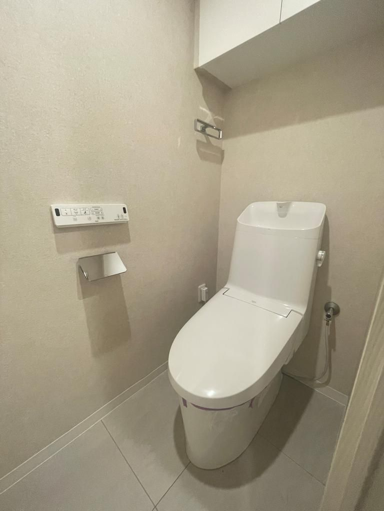 多摩市落合１丁目の中古マンションのトイレ