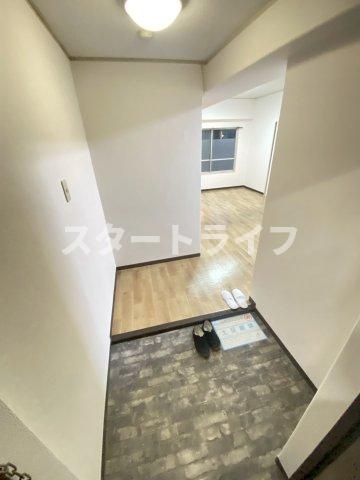 大阪市東淀川区西淡路１丁目の賃貸マンションの玄関