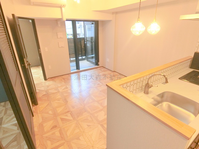 ザ・ライオンズフォーシア蒲田の居間・リビング