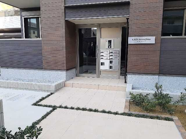 カーサ　カメジマのエントランス