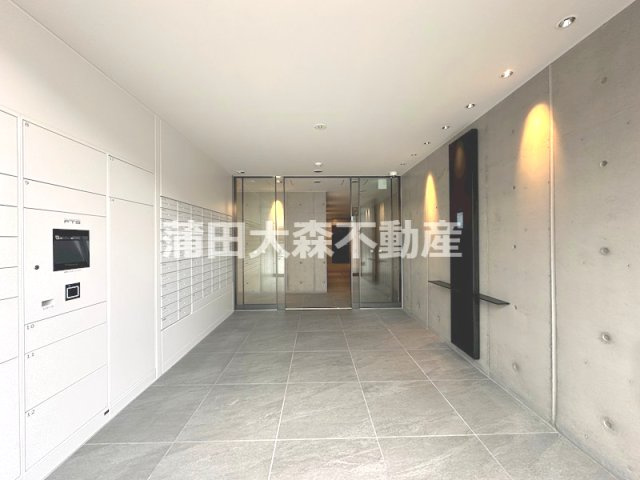 ZOOＭ蒲田EASTのエントランス|防犯カメラTVモニター付オートロック宅配BOXメールBOX管理人室