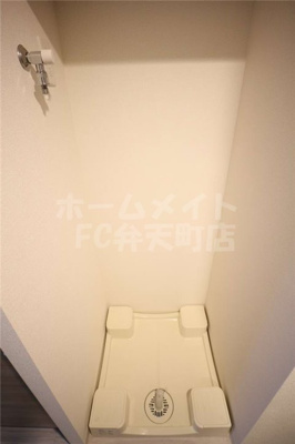 【その他】 | プレサンスOSAKA DOMECITYビーツ | 室内洗濯置場です