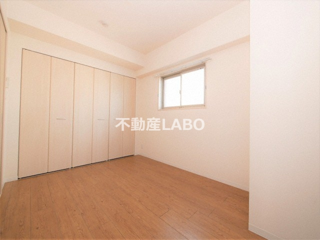 グランデカワノ真田山の洋室