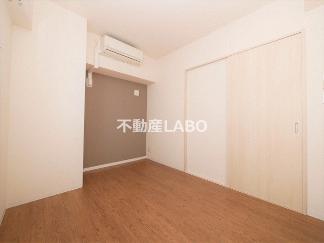 グランデカワノ真田山の寝室