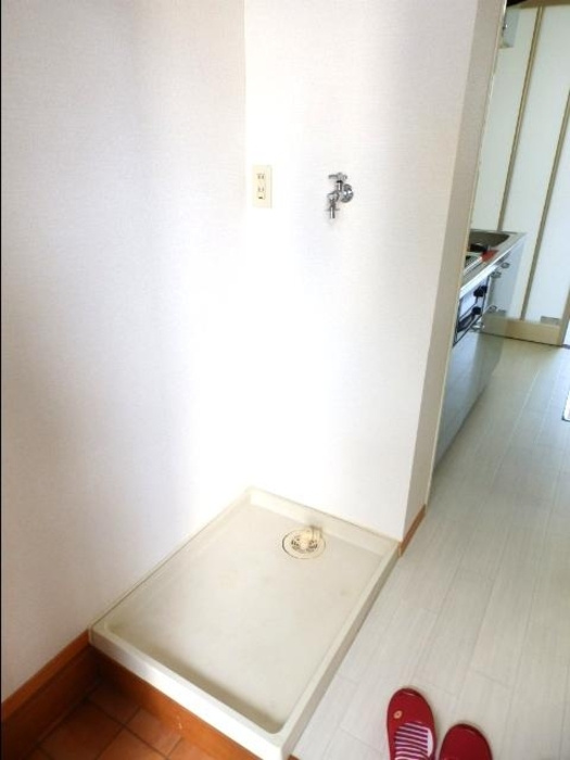 ミントグリーンの洗面所|洗濯機置き場