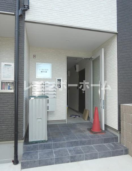 ジーメゾン越谷大袋のエントランス