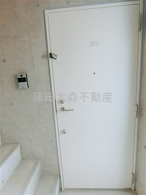 アヴニール多摩川の玄関