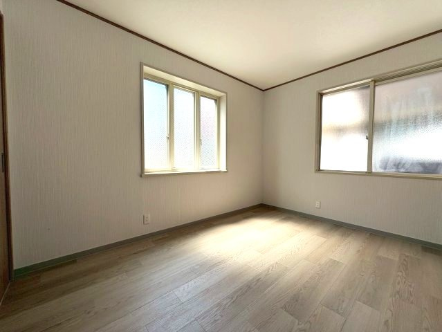 新栄プロパティーはびきのⅡの寝室