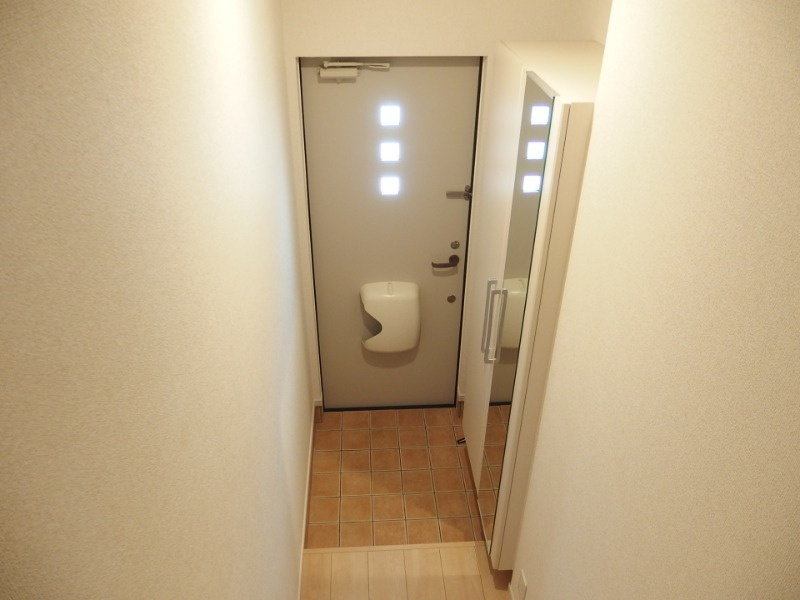 プルミエール信の玄関