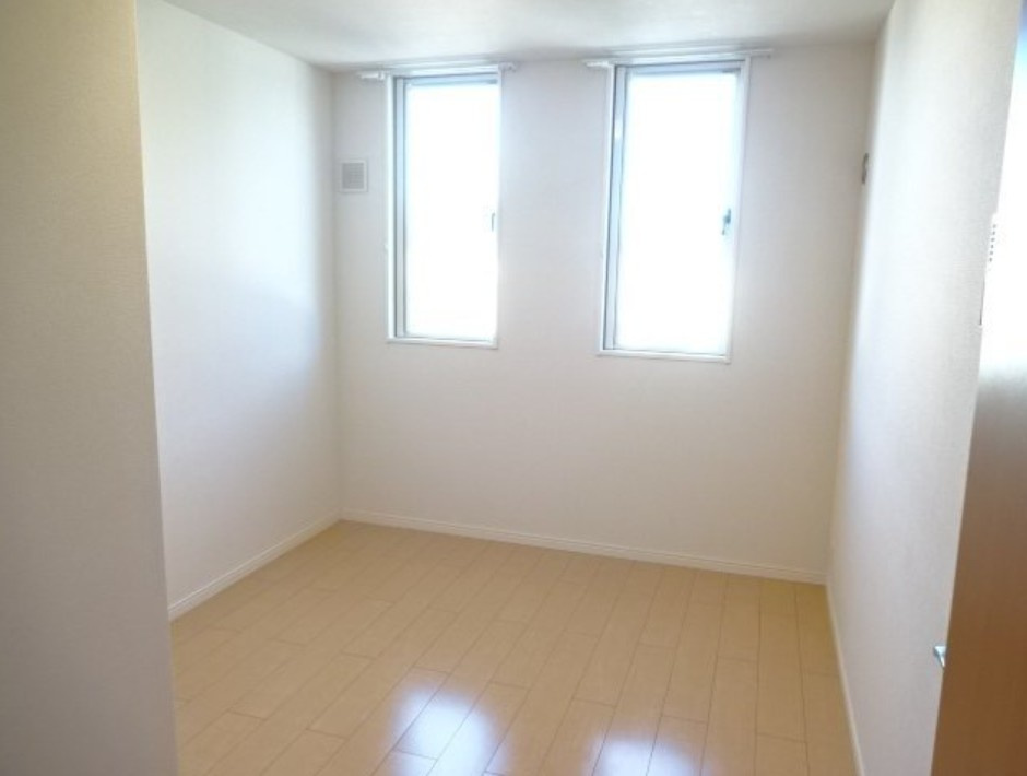 稲城市百村のアパートの寝室