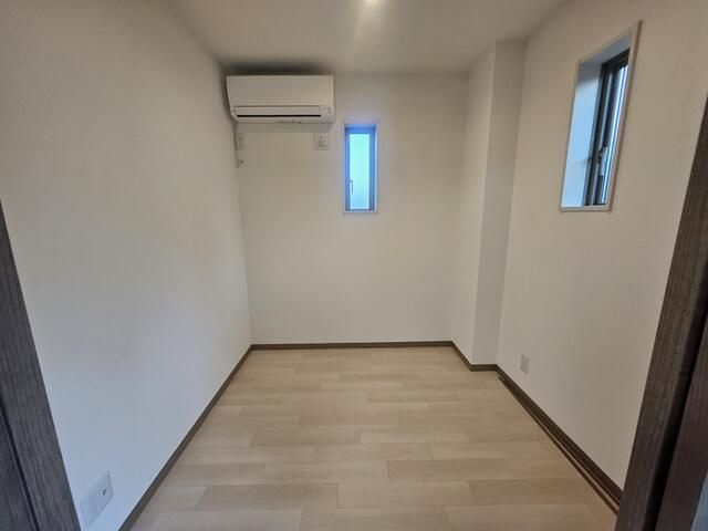 コンフィデンス東大宮Gの寝室