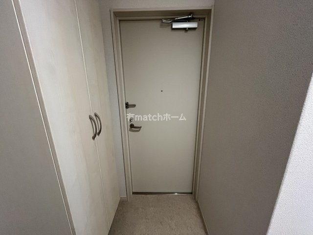 アルカンシェルコート緑橋の玄関