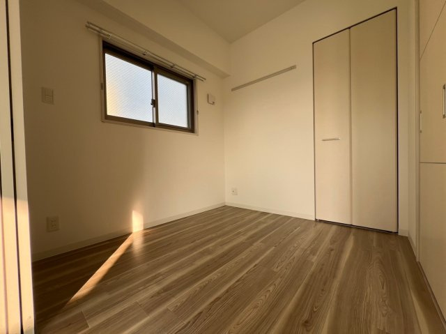 プレミアムコート千里丘の寝室