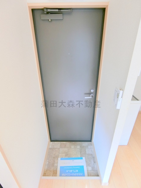 リプロンビギン蒲田24の玄関