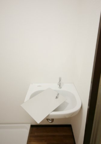石塚マンションの洗面所|※別部屋同間取りのお写真となります。参考にご覧くださいませ。