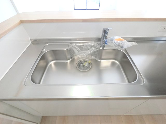佐賀市北川副町光法第3 2号棟のキッチン|浄水機能付きの蛇口