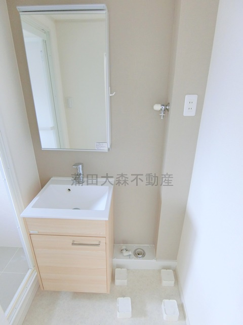 本羽田住宅の洗面所|洗面脱衣所　独立洗面台　室内洗濯機置き場