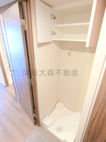 ザ・パークハビオ大森町の設備|吊戸棚付きの室内洗濯機置き場