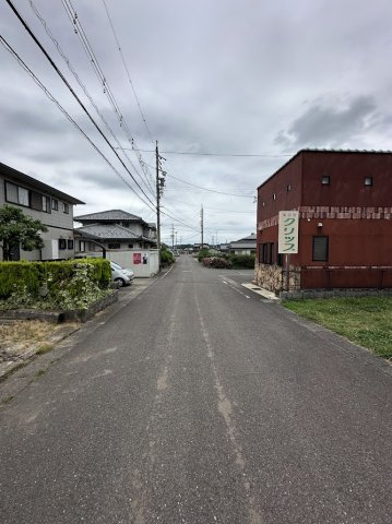 土地　松栄町１丁目の前面道路含む現地写真