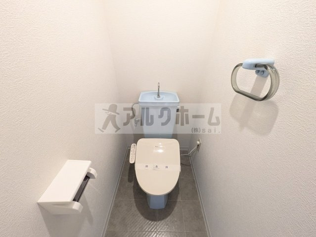 柏原市国分本町１丁目の賃貸マンションのトイレ