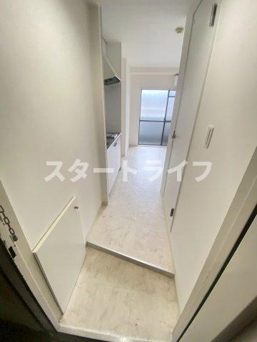 大阪市淀川区十三東３丁目の賃貸マンションの玄関