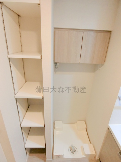 ルーブル本羽田の設備|洗面所収納　洗濯機置き場