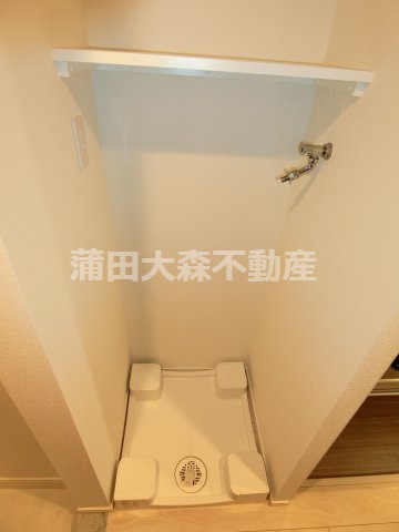 スパシエ蒲田グランドタワーの設備|棚付きの洗濯機置き場