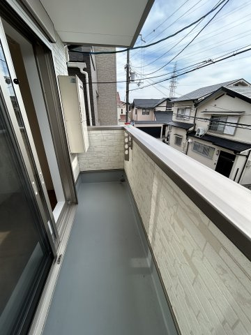 メゾンWO南七松のバルコニー