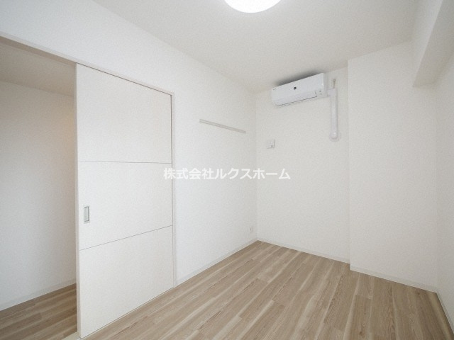 プレミアムコート千里丘の寝室