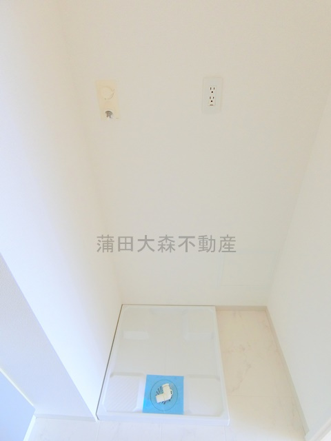 六郷土手分譲賃貸マンションの設備|室内洗濯機置き場