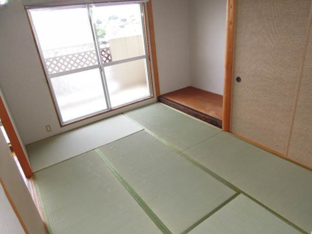 コープ野村京山の寝室