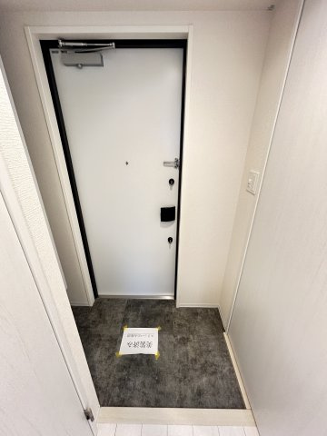 ファーストフィオーレ塚本ウェルビングの玄関