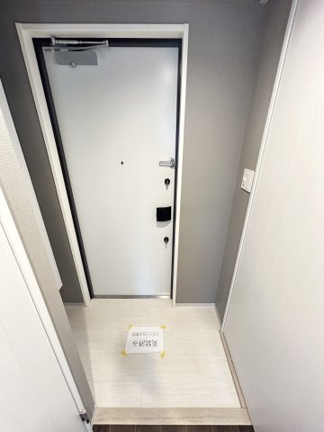 ファーストフィオーレ塚本ウェルビングの玄関