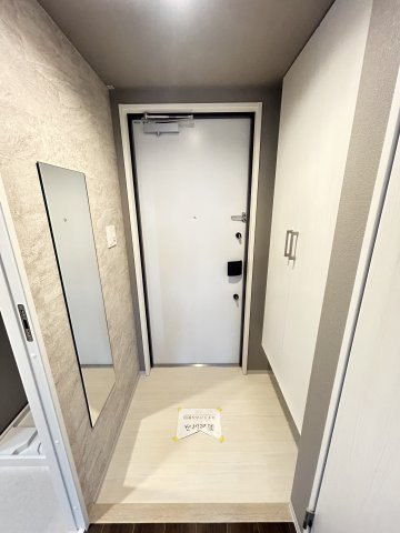 ファーストフィオーレ塚本ウェルビングの玄関