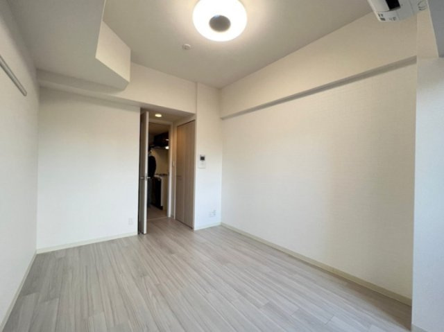 プレサンスOSAKA DOMECITY クロスティの寝室