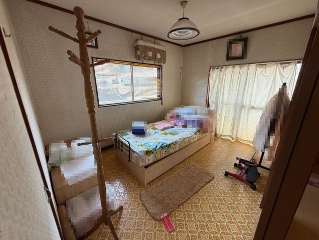田川市千代町 カーポート　4LDKの寝室